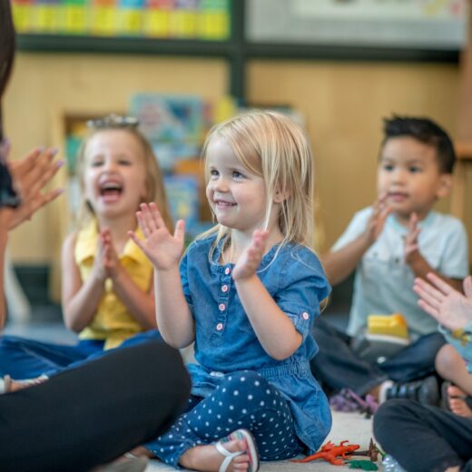 Kids engaging with their teacher.